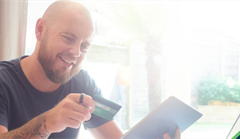 Man making online purchase with credit card